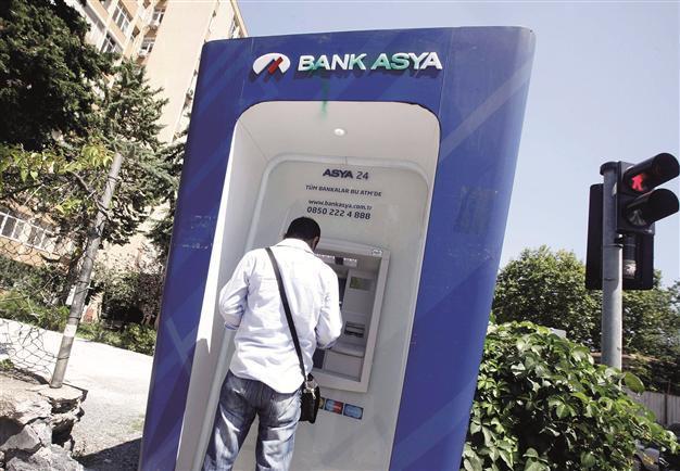 Bank Asya moves to save capital as president calls on watchdog to intervene