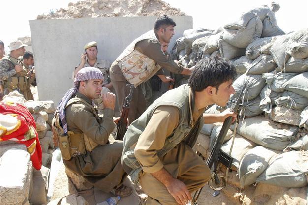 Backed by strikes, Kurds battle for key Syria town