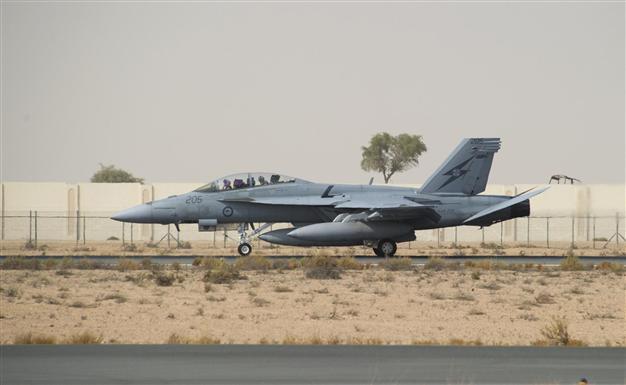 Australia deploys special forces, joins air strikes in Iraq