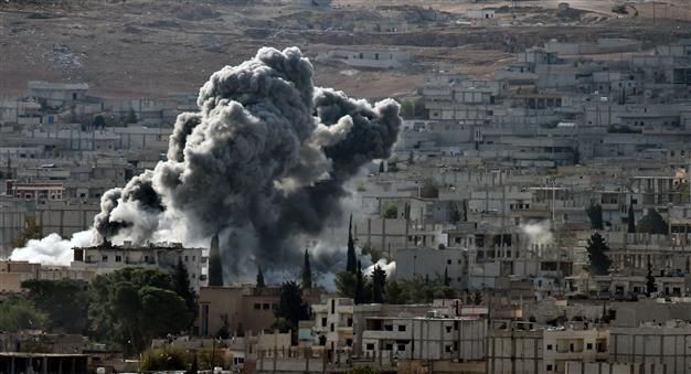 US-led air strikes in Syria kill 553 in first month: monitor