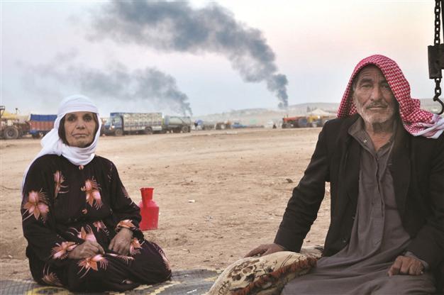 Families left in Kobane gasping for life under bullets and bombs