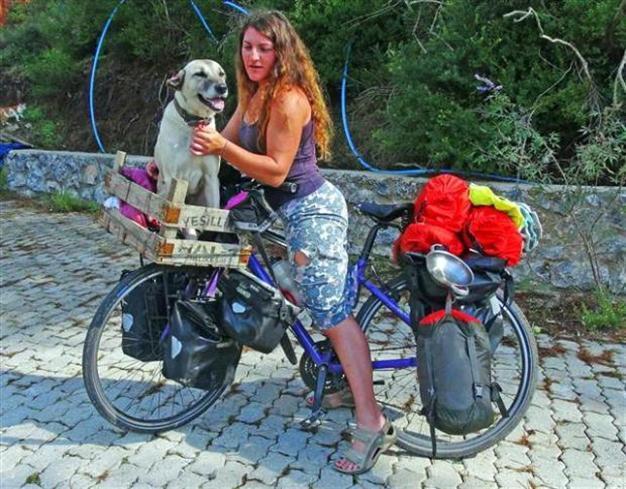 IN PHOTOS: Scottish cyclist interrupts world tour to save stray dog