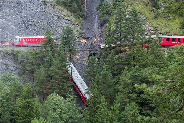 Swiss train carriage plunges into ravine after landslide