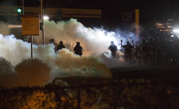 Police fire tear gas, stun grenades to disperse protesters in Missouri