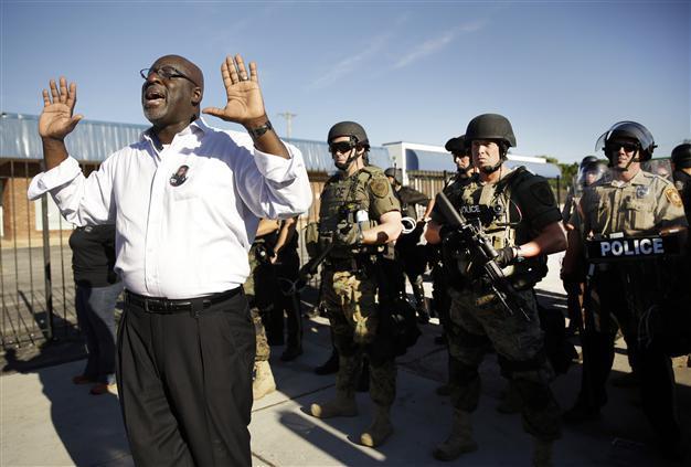 Tear gas fired at protesters after US teens death