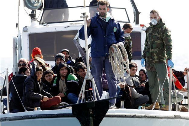 700 migrants begin disembarking on Greek island of Crete