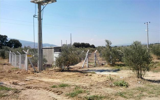 Seized olive groves in Soma surrounded by wire fence to make way for third thermic plant