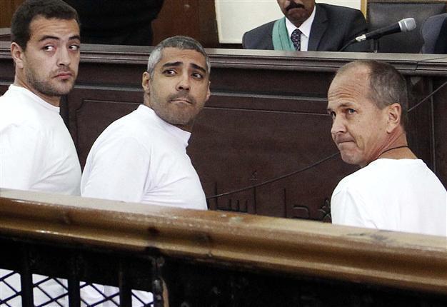 Egypt court orders retrial of jailed Jazeera reporters