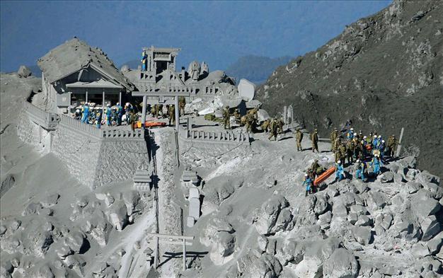 At least 36 feared dead on Japanese volcano, search called off