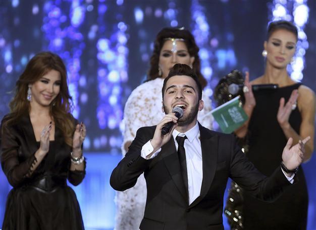 Syrian wins Arab song contest, keeps clear of politics