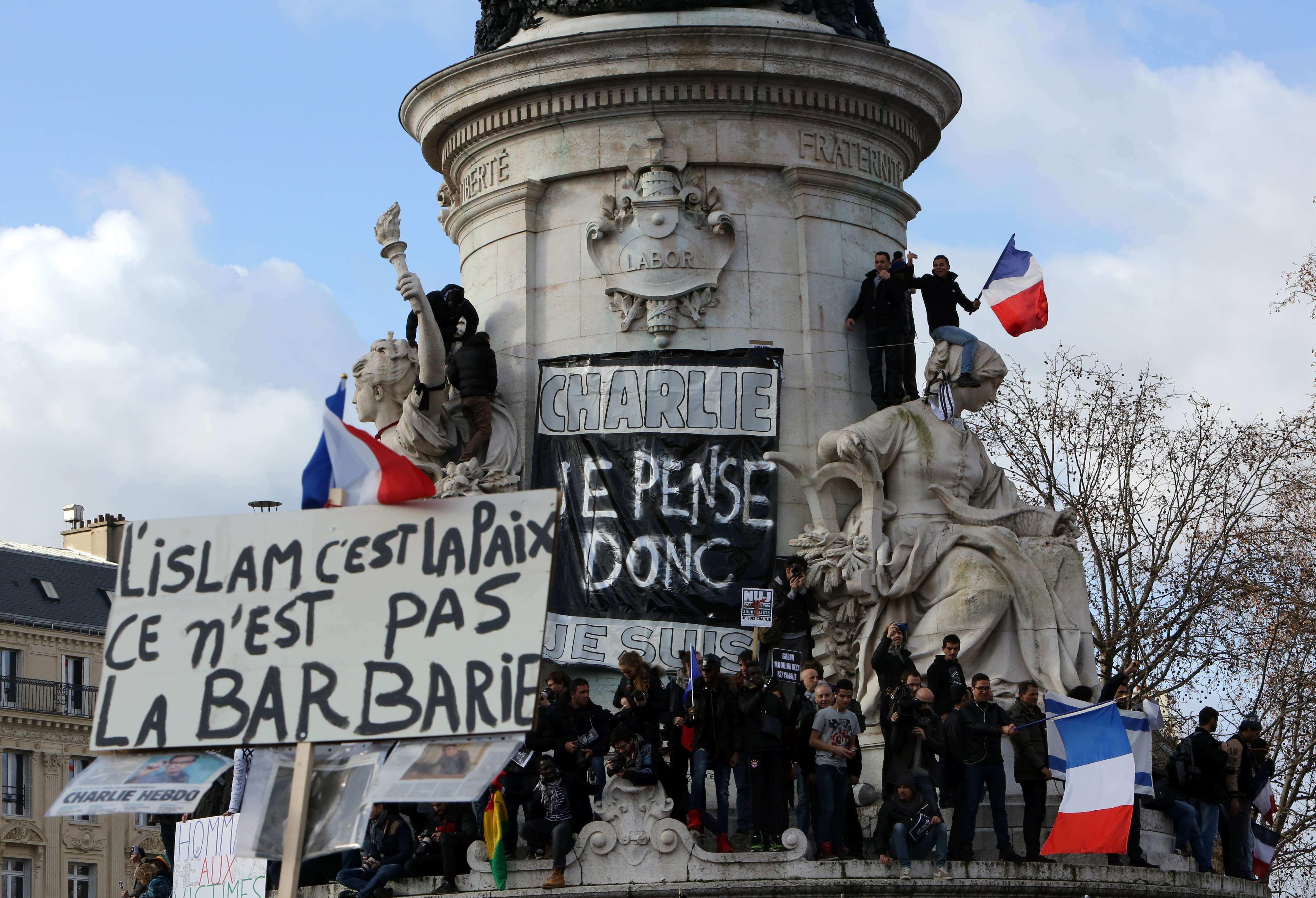 Crowds gather for historic Paris march of defiance and sorrow