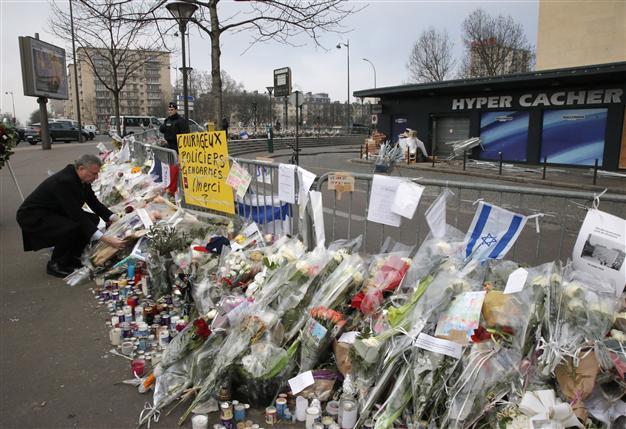 Four to face possible charges over Paris attacks: prosecutor