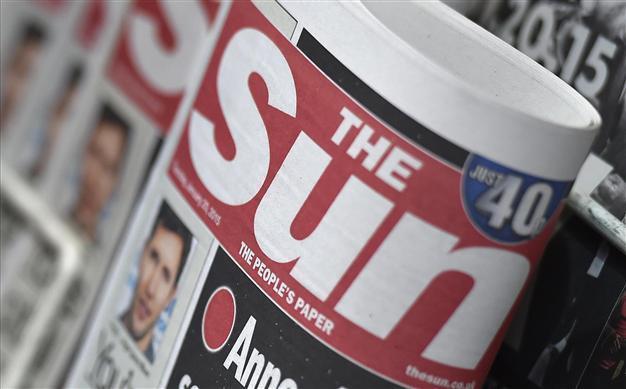 The Sun covers them up, ending topless tradition