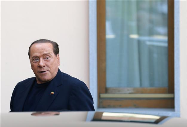 Italys Berlusconi wins early release from community service