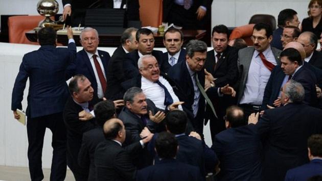 Opposition deputy falls from stairs at Turkish parliament amid fight over security bill