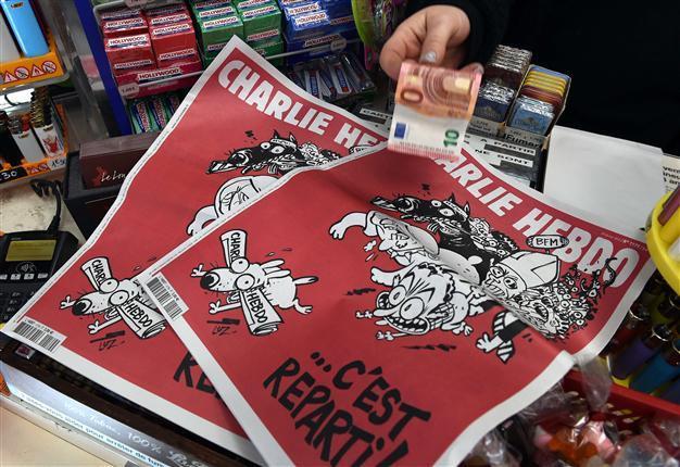 Two months after attack, splits at Charlie Hebdo over money