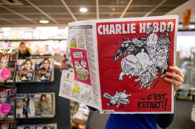 Charlie Hebdo team bites back with new issue