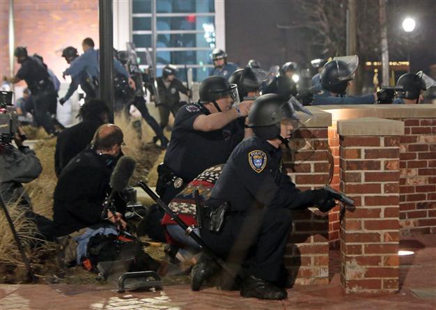 Two officers shot outside Ferguson police HQ after chief quits
