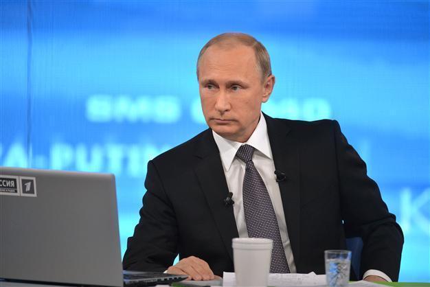 Putin sees return to growth in Russia in under 2 years