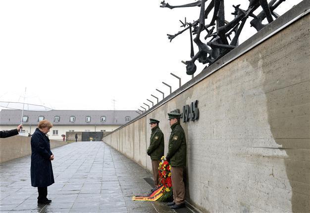 Merkel joins Holocaust survivors to mark Nazi camps liberation
