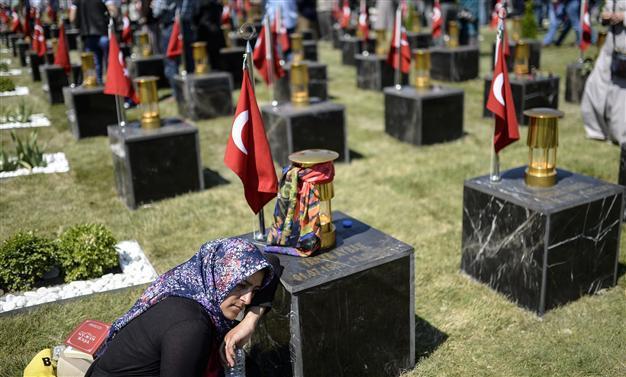 Families flock to the graves of Soma victims on first anniversary of Turkey’s deadliest mining accident