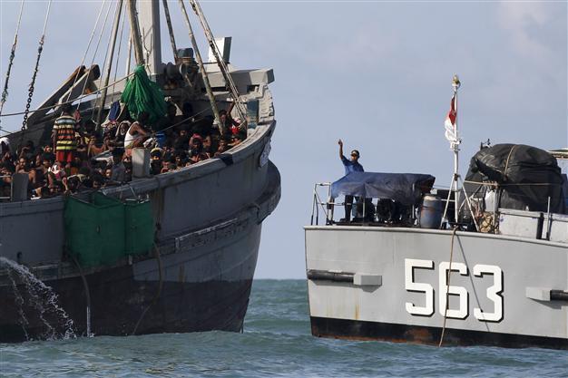 Myanmar navy to verify 727 stranded migrants in safe place