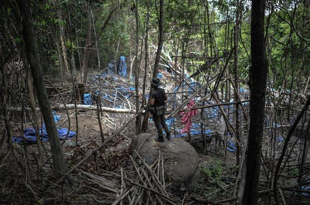 Malaysian police reveal grim secrets of jungle trafficking camps