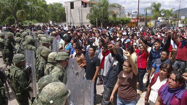 At least 10 dead as vigilantes clash in Mexico