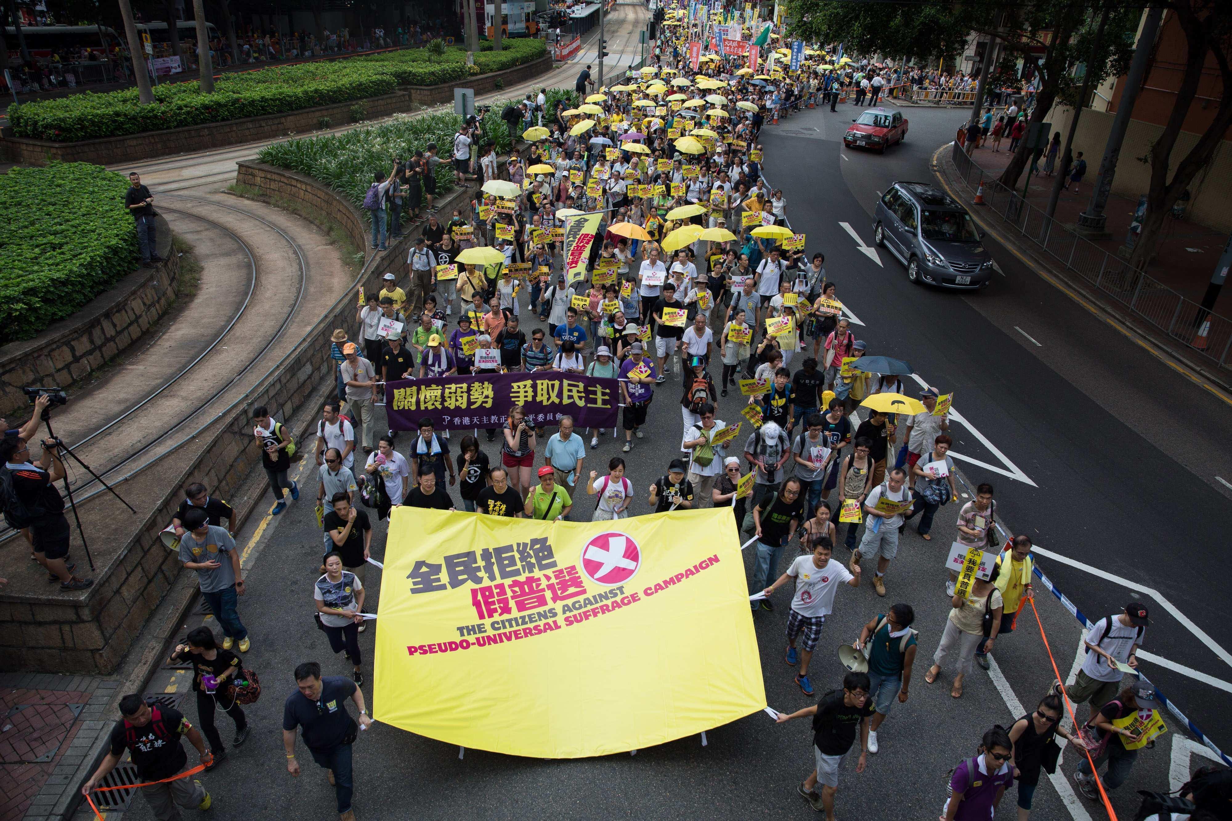 Hong Kong democracy groups take to streets as key vote looms