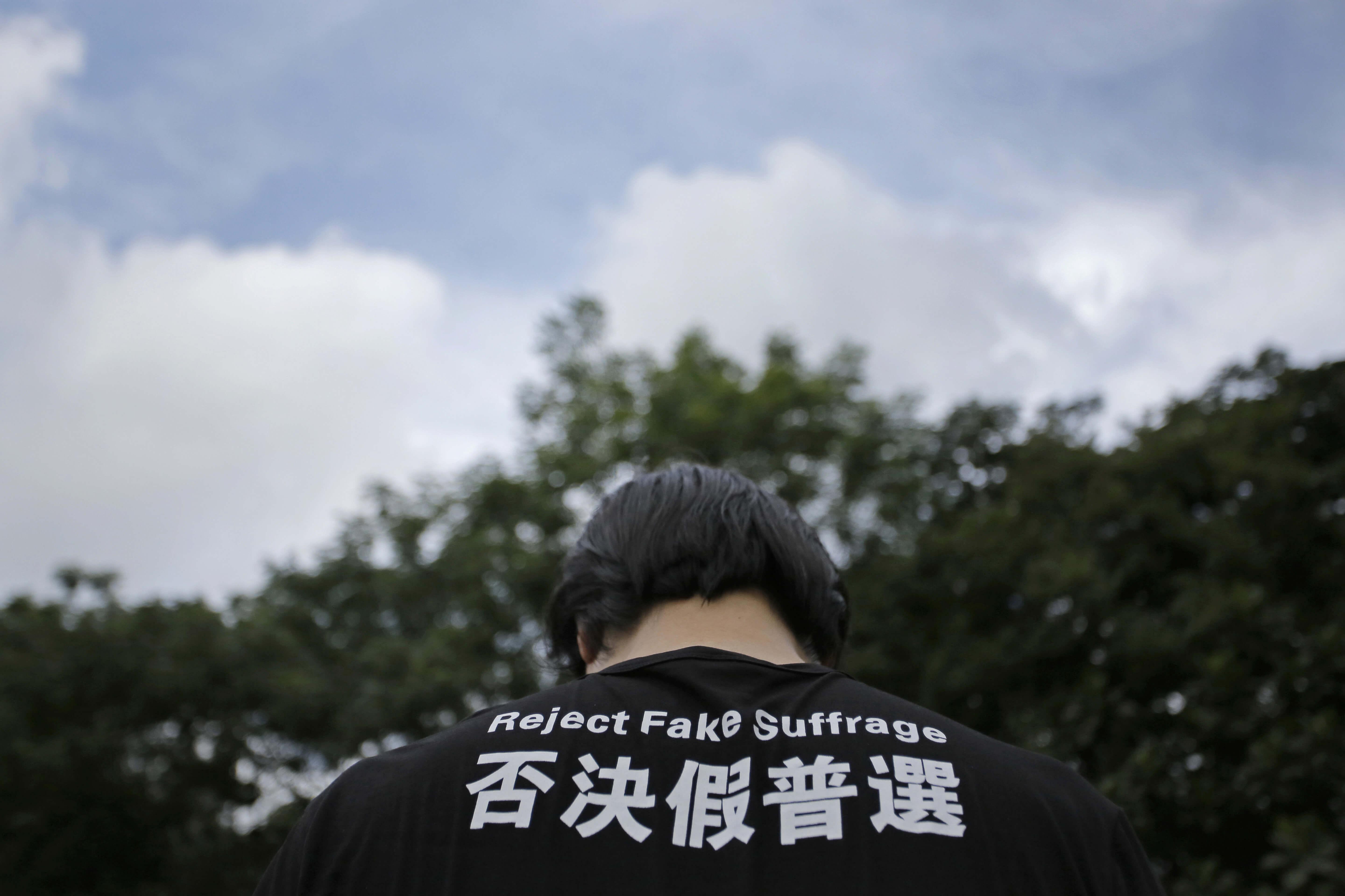 Hong Kong democracy groups take to streets as key vote looms