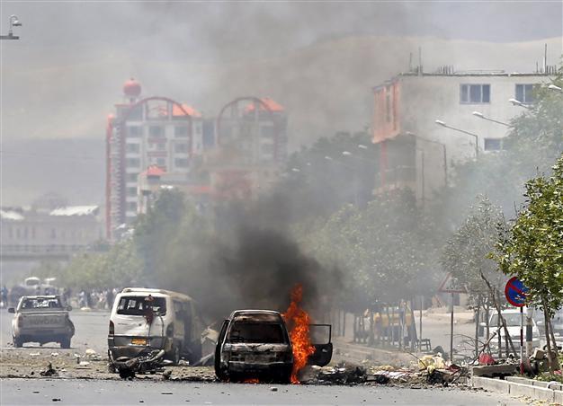 Taliban suicide bomber, gunmen attack Afghan parliament