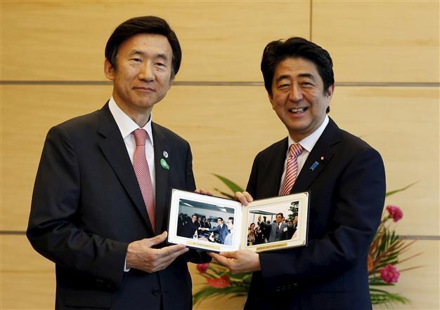 Japans Abe pledges to improve ties with S. Korea