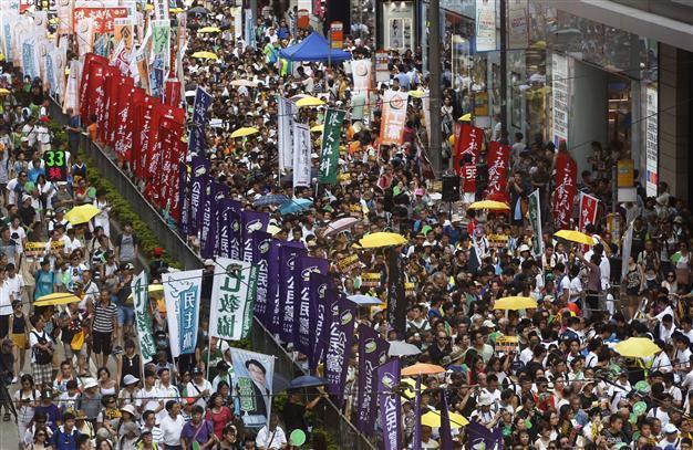 Democracy camp seeks new direction at Hong Kong protest march