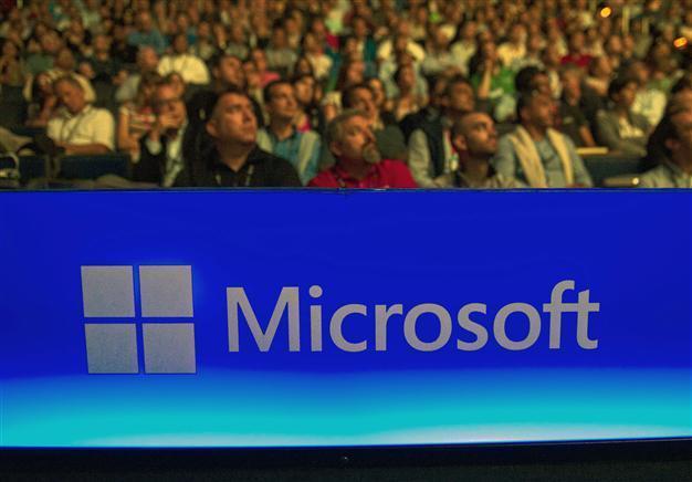 Microsoft cuts 7,800 jobs, reorganizes phone unit
