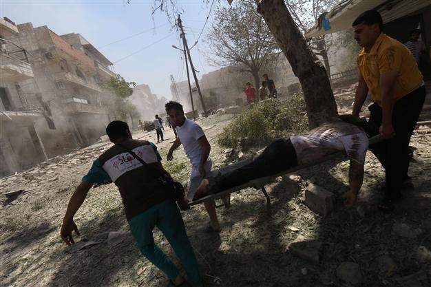 Barrel bombs kill 11 civilians in ISIL town in Syria