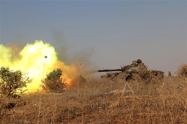 Syria rebels rain rockets on Shiite villages: monitor