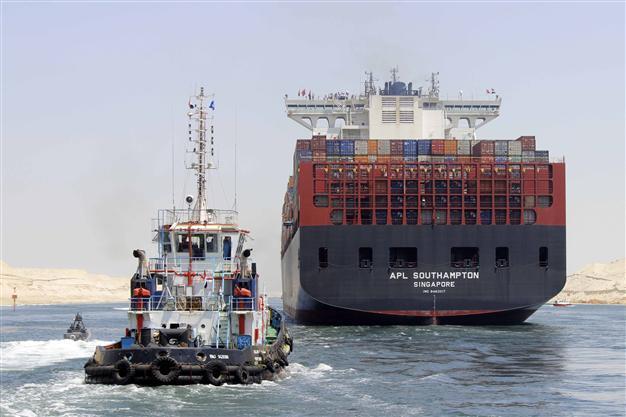 Ships cross Egypts New Suez Canal in first test-run