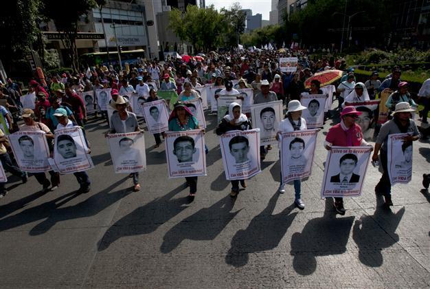 Mexico search for missing students turns up 129 bodies