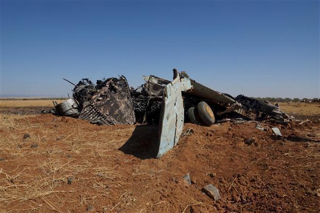 At least 35 killed as Syrian jet crashes into market