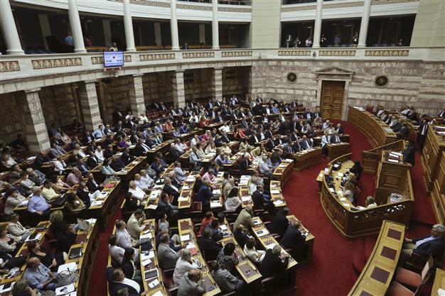 Greek lawmakers back 3rd bailout after all-night debate