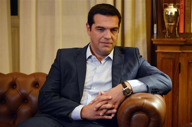 Greeces Tsipras resigns, calls snap polls to beat party revolt