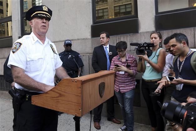 US police searching for motive in NYC federal building shooting