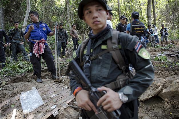 Malaysia finds more graves and human remains near Thai border