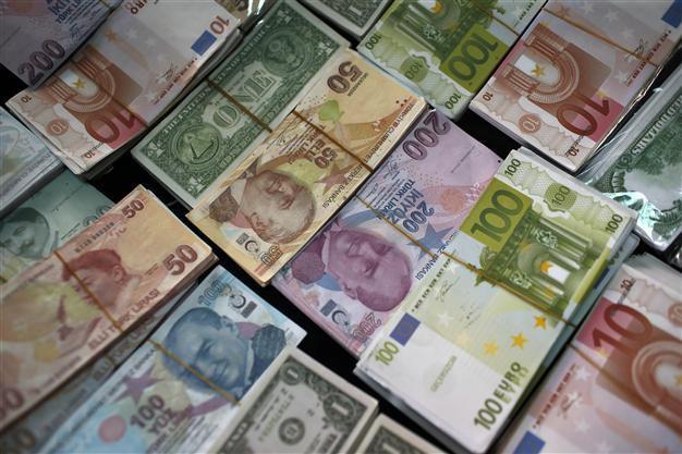 Emerging economies let currencies slide to stay competitive