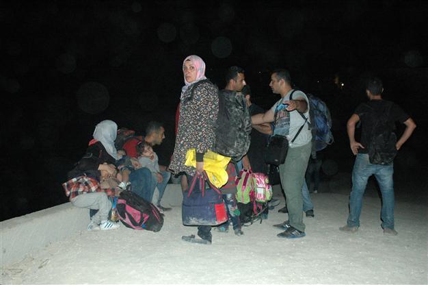 Human smugglers set inflatable boat aflame and vanish, after migrants object to boat