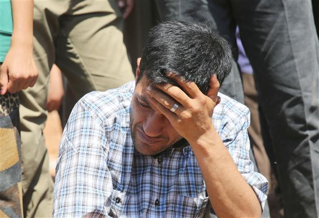 Drowned Syrian boy buried in war-torn Kobane