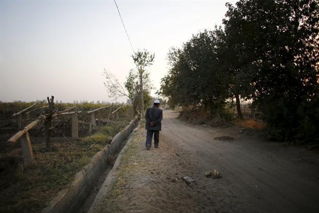 In Uighur heartland, China vows heavy pressure to defeat militants