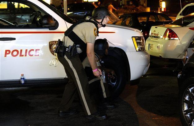 Shots fired as Ferguson marks anniversary of teens death
