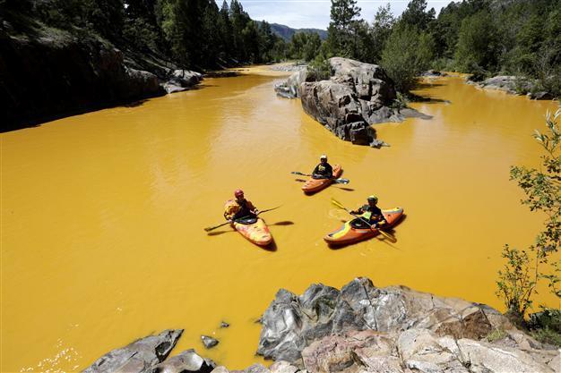 US anti-pollution workers turn river orange in toxic spill