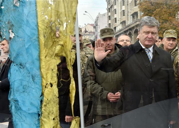 Poroshenko faces judgement day as Ukraine votes without rebel east